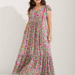 BloomChic Pink Floral Maxi Dress on Green Background.